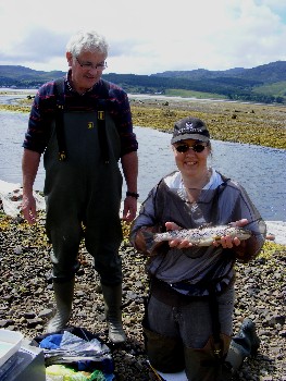 Billy Forbes and Karen Starr with a 435mm trout from the mouth of the River Carron